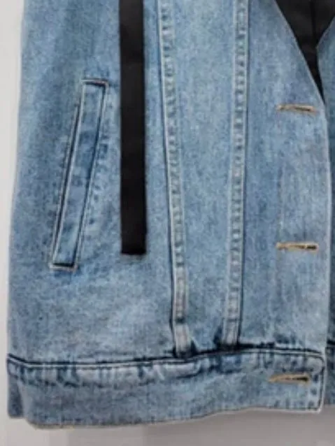 Blue jeans and black vest